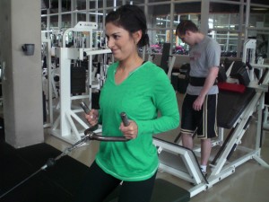 High Performance Personal Training client Newsha client lifting weights