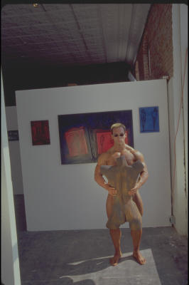 bodybuilder holding female torso sculpture 3